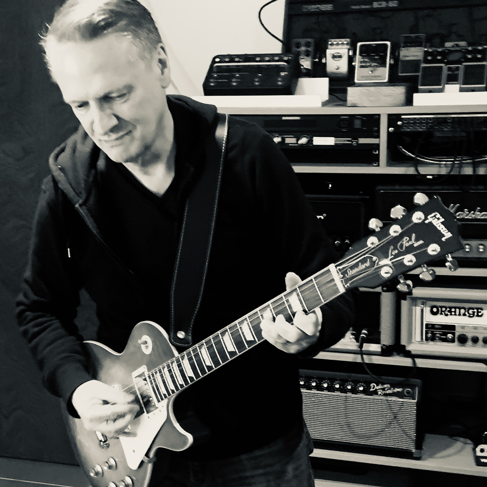 Matt Ottewill playing guitar in the recording studio